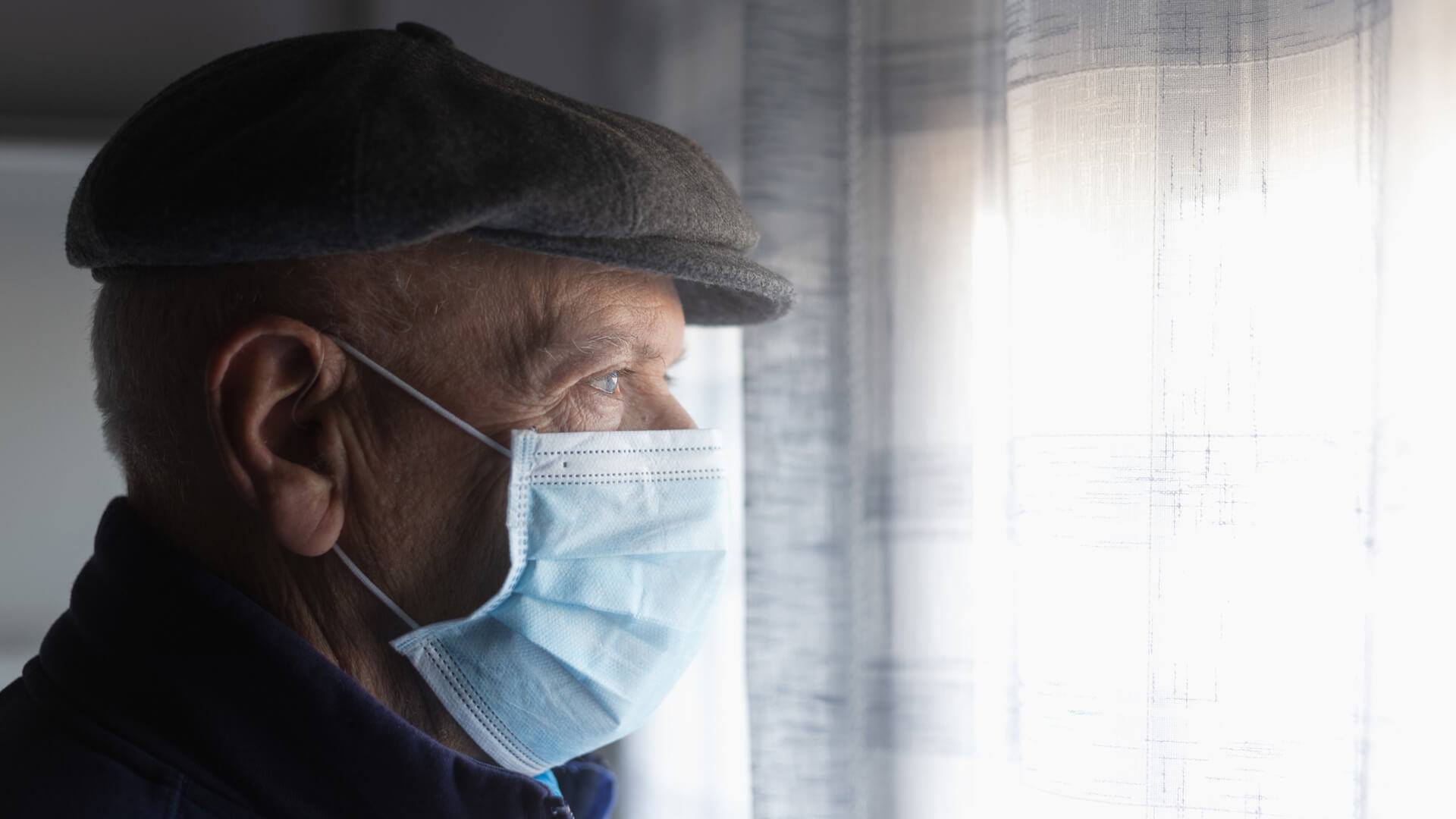 A senior man wearing mask during COVID-19 in his senior housing