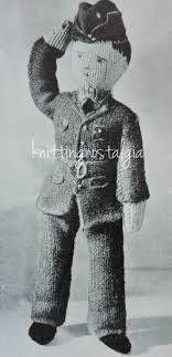 A knitted doll in a black and white photograph