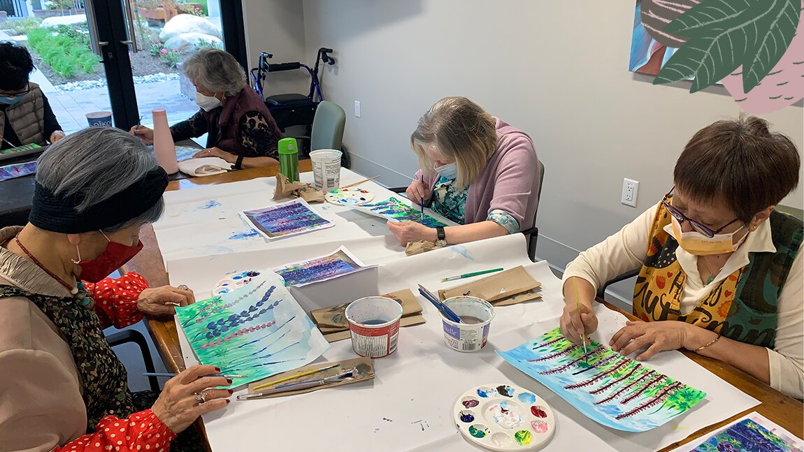 A group of elderly ladies doing painting, fun activities for seniors