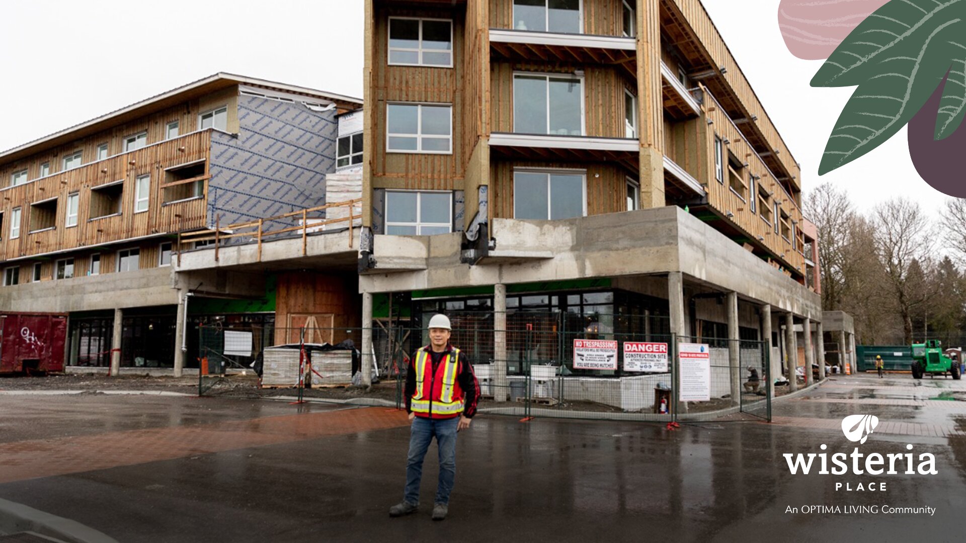 A man standing outside a senior home under construction