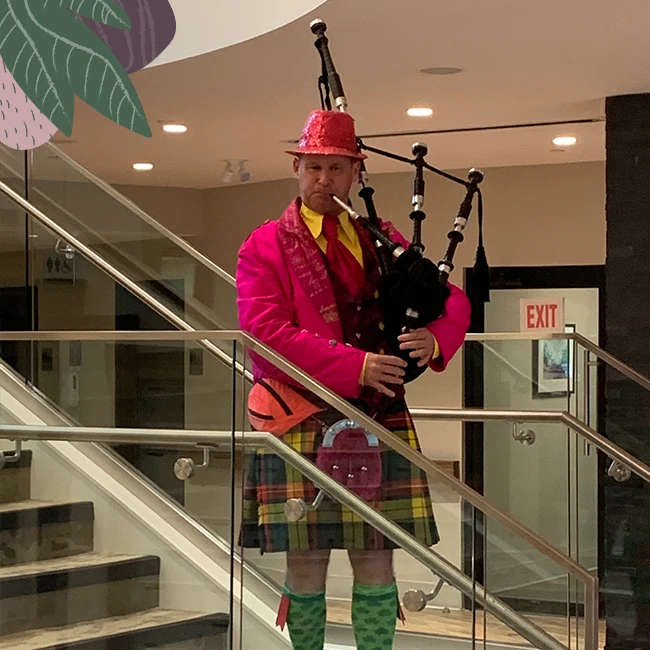 A man playing musical instrument in wisteria place retirement home