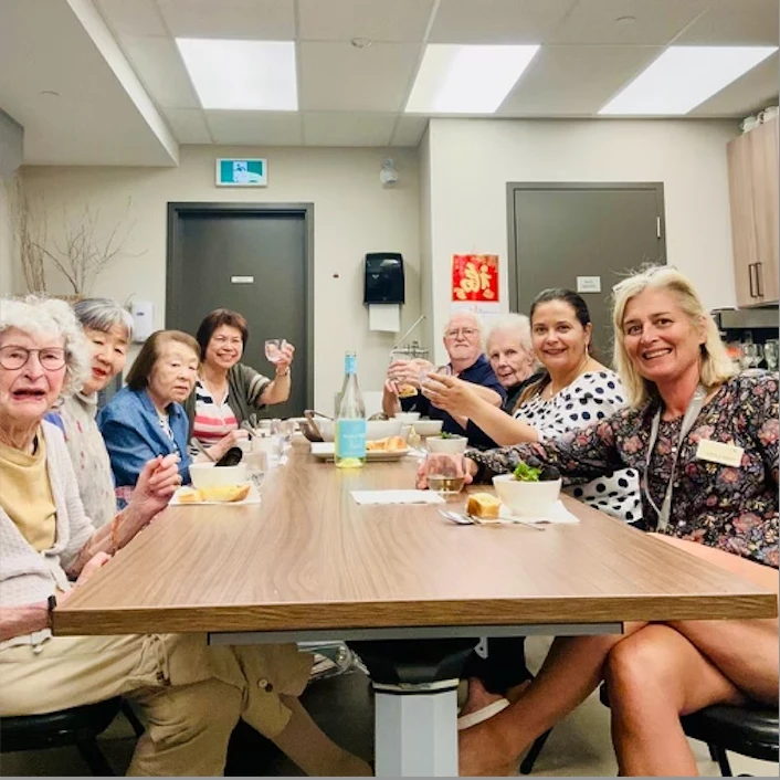 Seniors seated together enjoying the cooking class