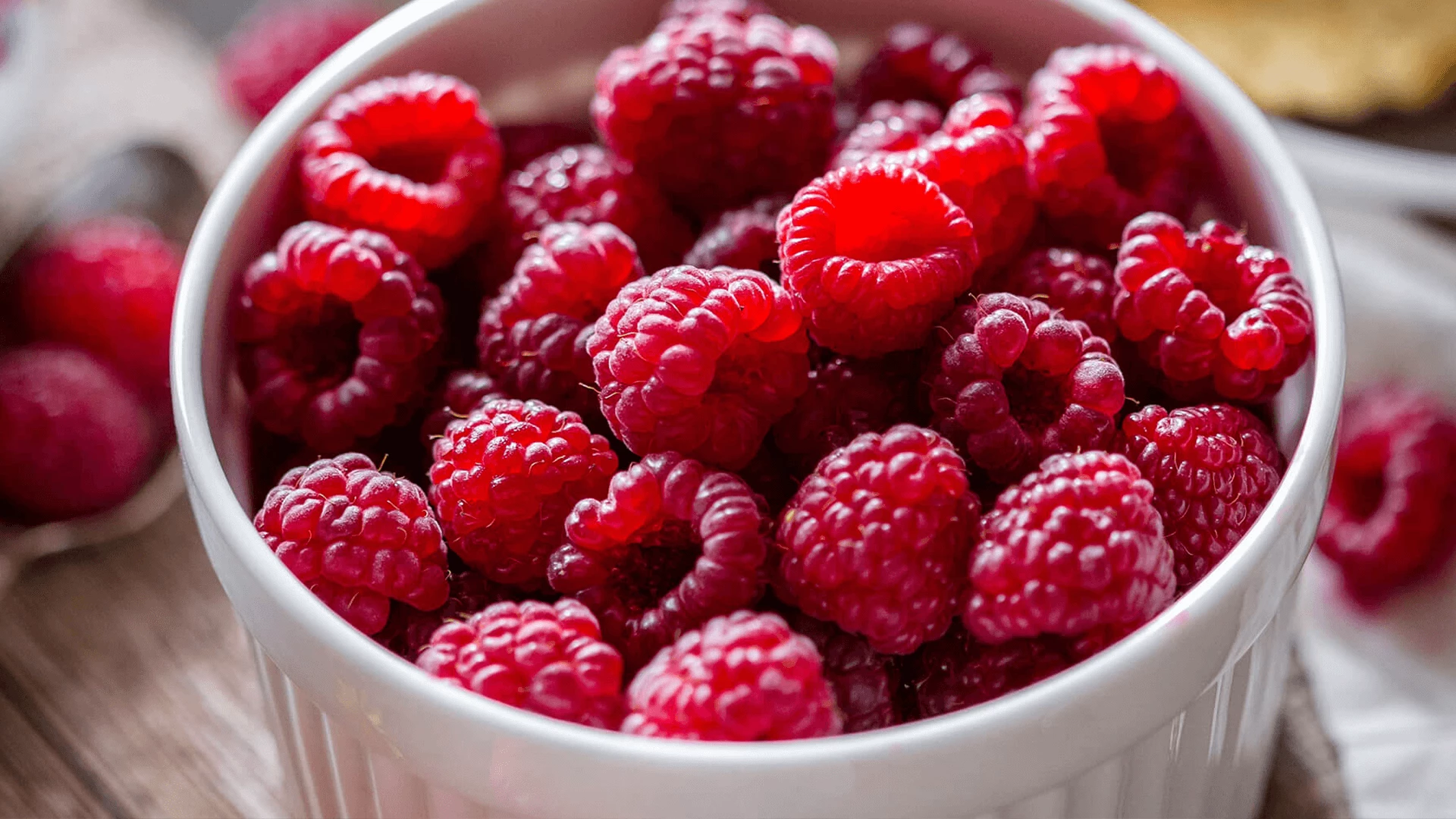 A bowl of raspberries, a soft snack for the elderly