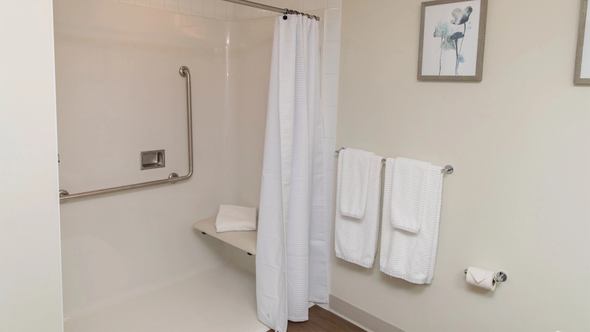 A walk-in shower in a Wisteria Place senior apartment