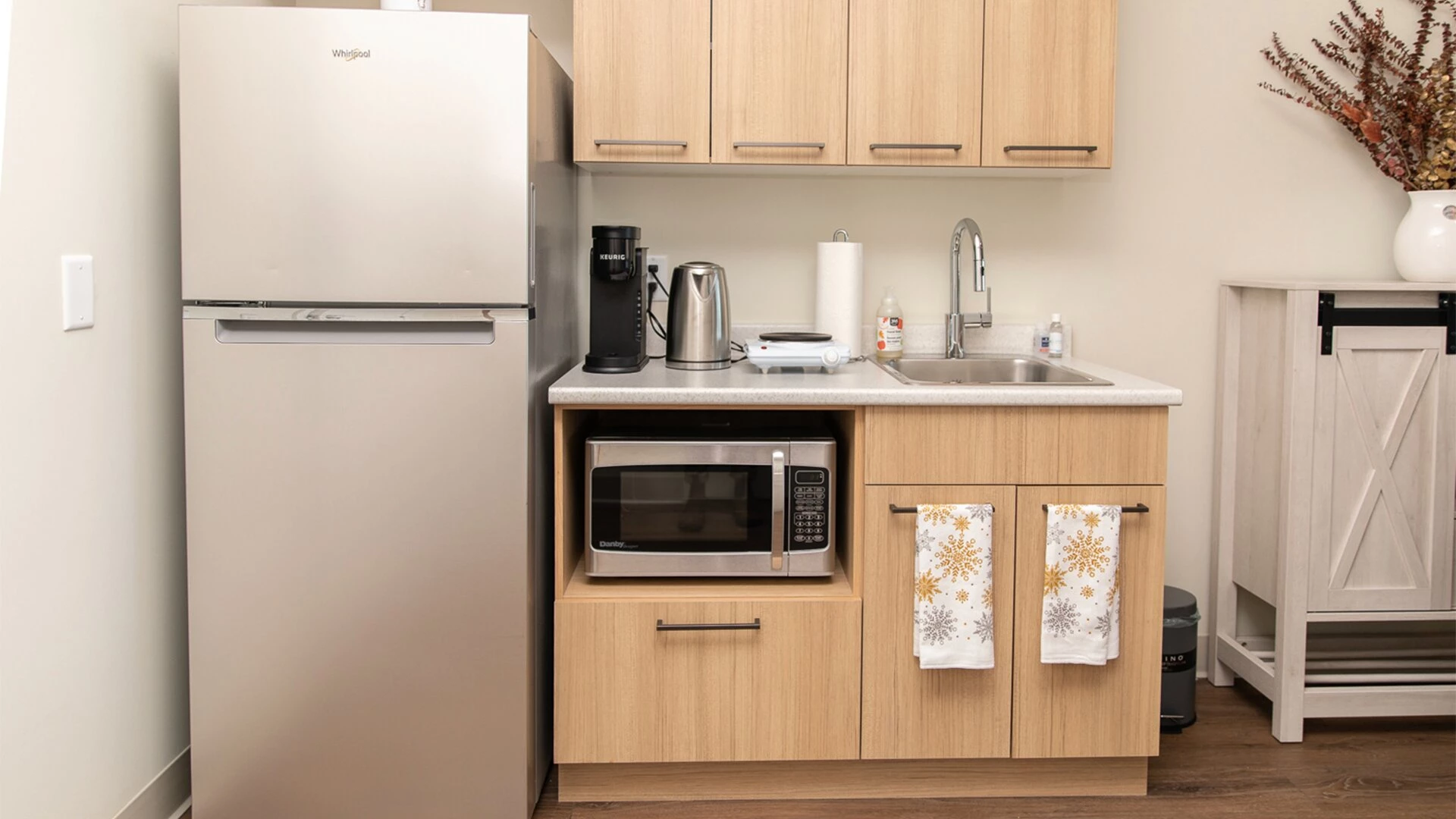 The view of a kitchenette in a Wisteria Place senior apartment