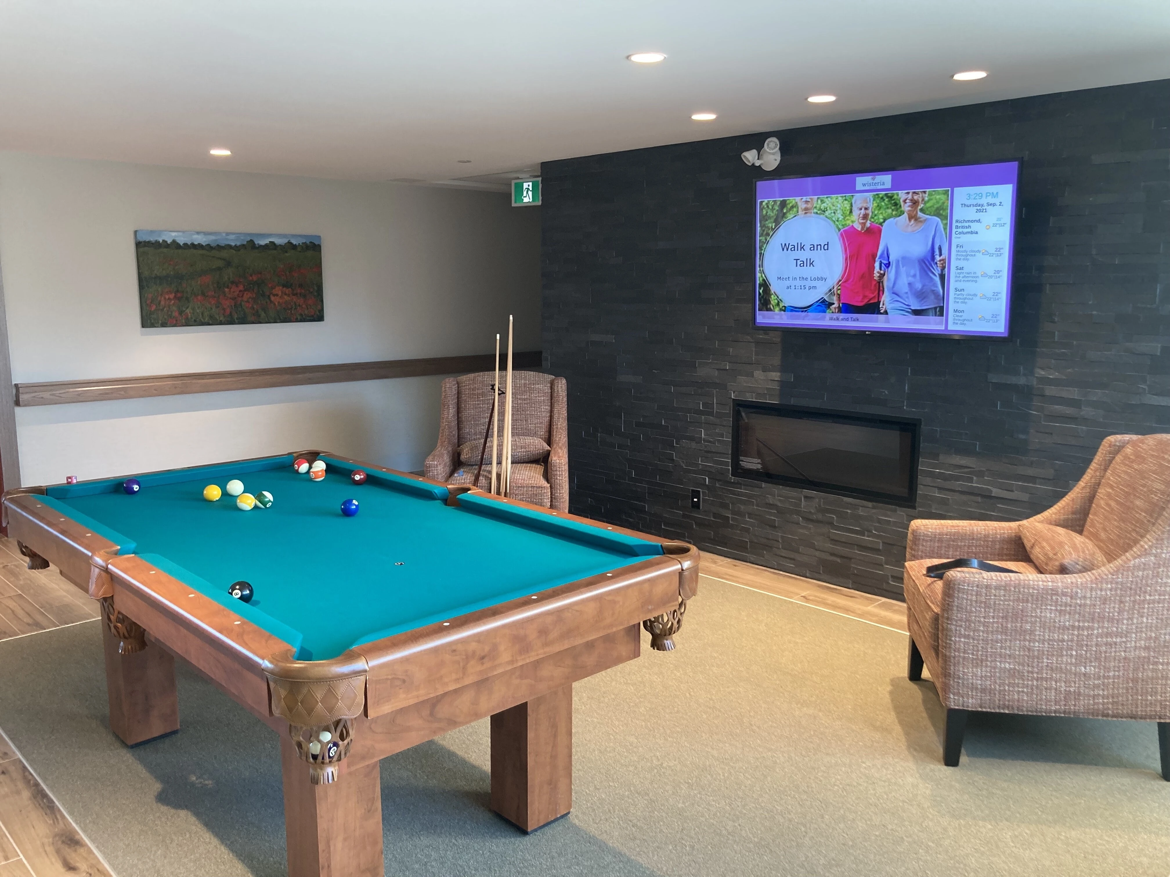 A pool table in room at Wisteria Place senior living