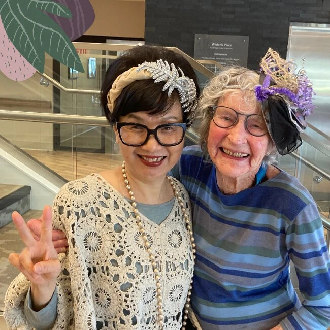 Two elderly women taking selfie in Wisteria Place senior living