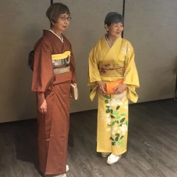 Two Chinese women wearing traditional clothes in senior living