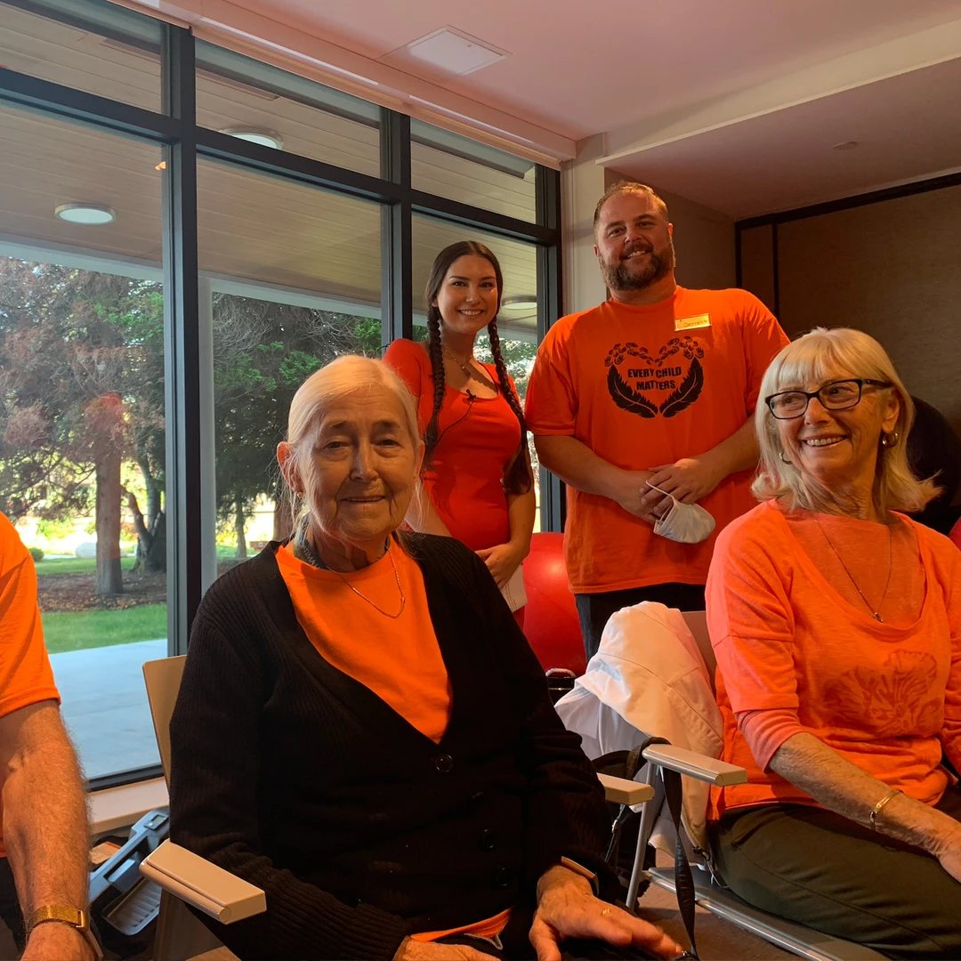 Residents wear orange t-shirts on truth and reconciliation day at their retirement home
