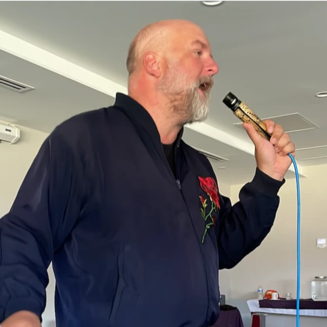 Performer singing into a microphone