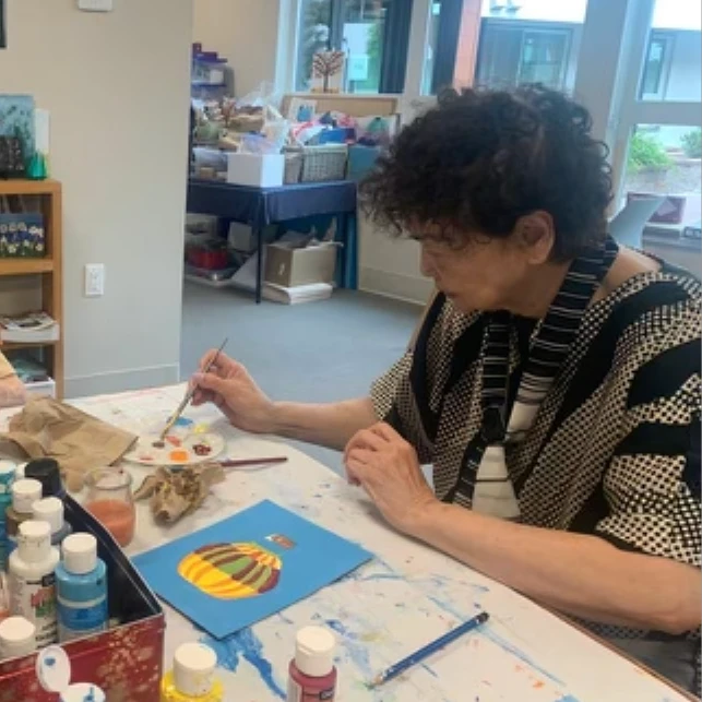 Senior painting a hot air balloon